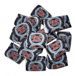 Pile of wrapped Black Jack licorice-flavored candies on a white background.