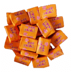 Pile of orange-wrapped fruit-flavored candies labeled "Fruit Salad."